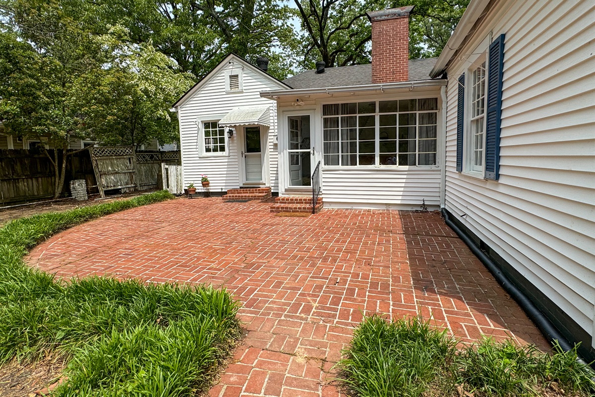 Exit the sunroom to find a beautiful patio area