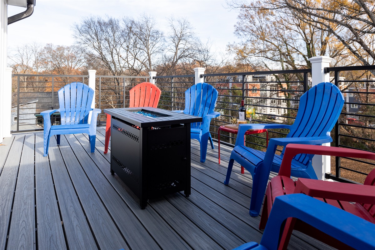 This rooftop deck has seating around the firepit for evening drinks and morning coffee.