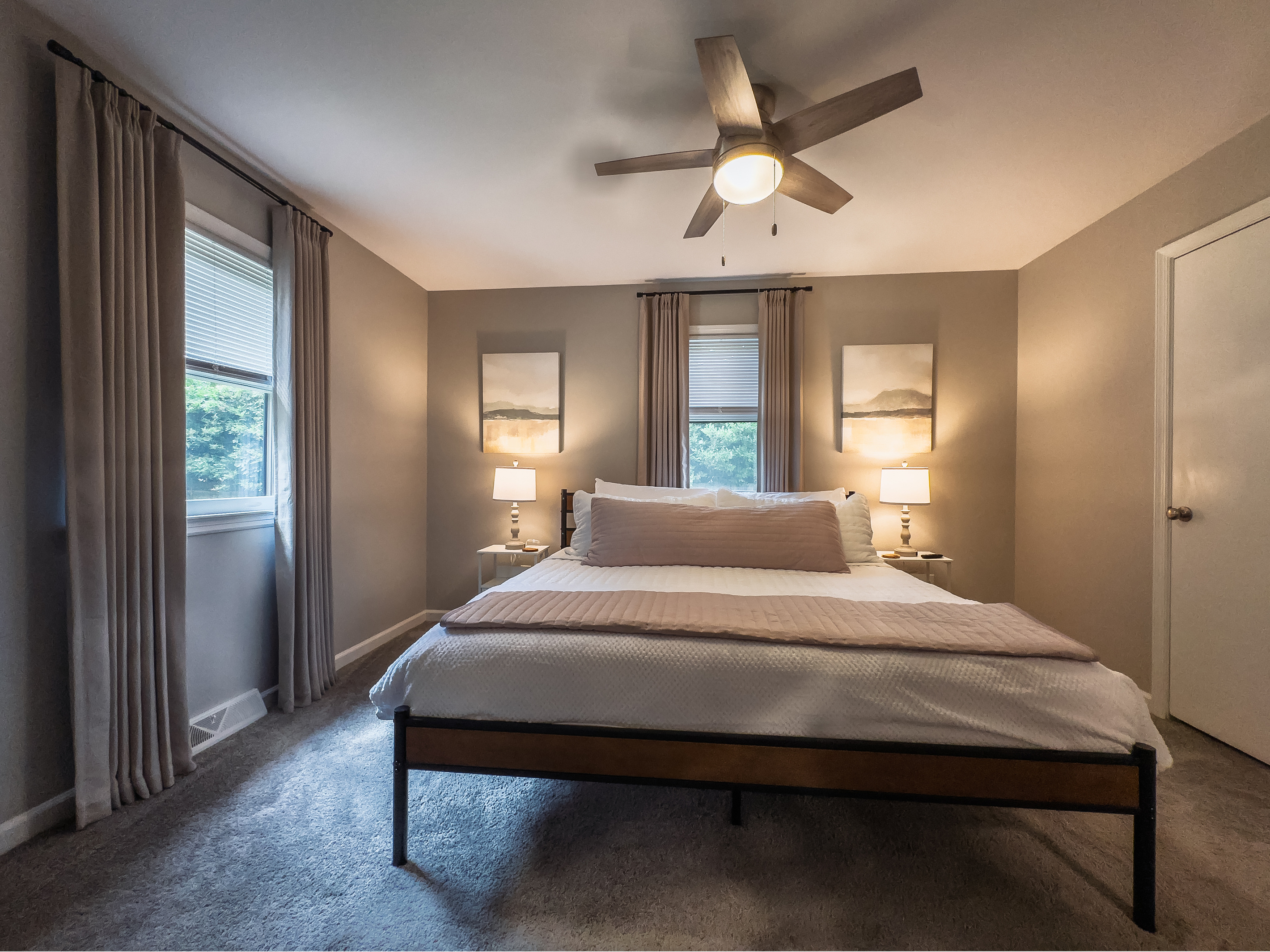 King bed, 55" Smart TV, ceiling fan, two led light nightstands with multiple charging ports, two multi light function lamps, blackout curtains, dual closets.