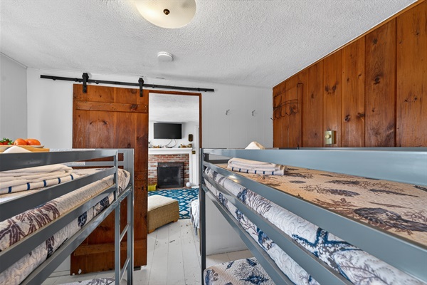 Double the bunks, double the memories, this cheerful room is made for together time and good sleep!