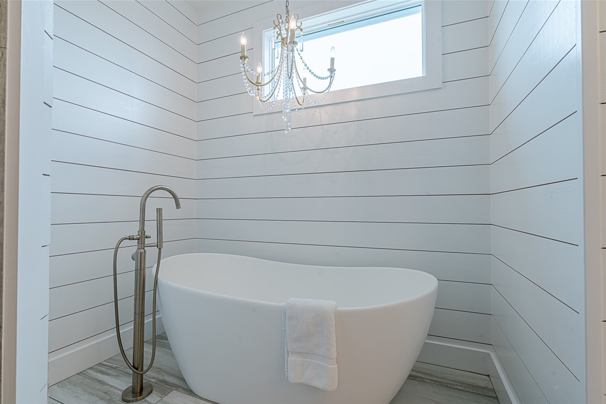 Melt your cares away in the free standing soaker tub. Tiled shower is also available in the master bath.