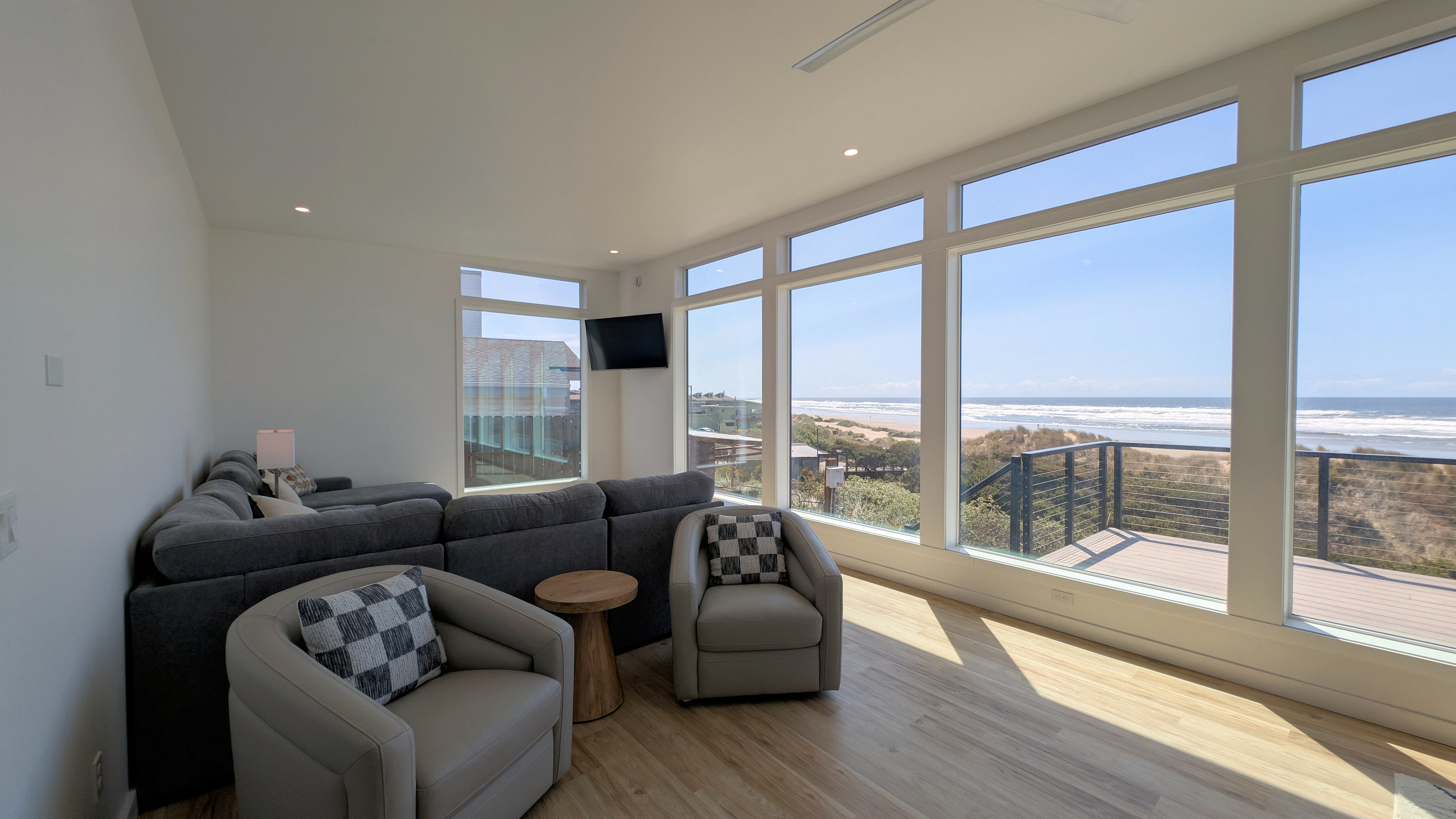 Living area with swivel club chairs and sectional sofa