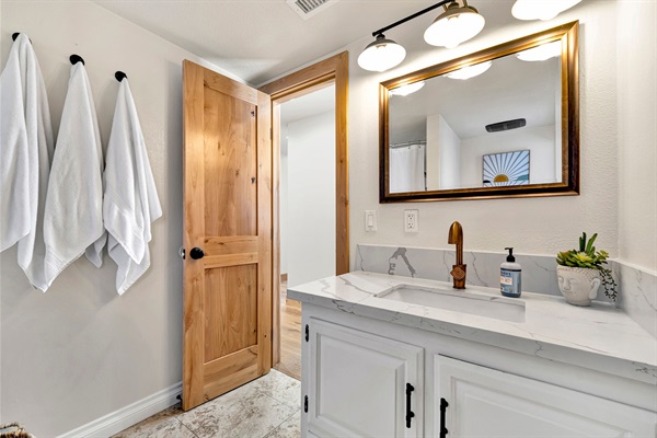 Spacious guest bathrooms stocked and ready — comfort and convenience for every guest