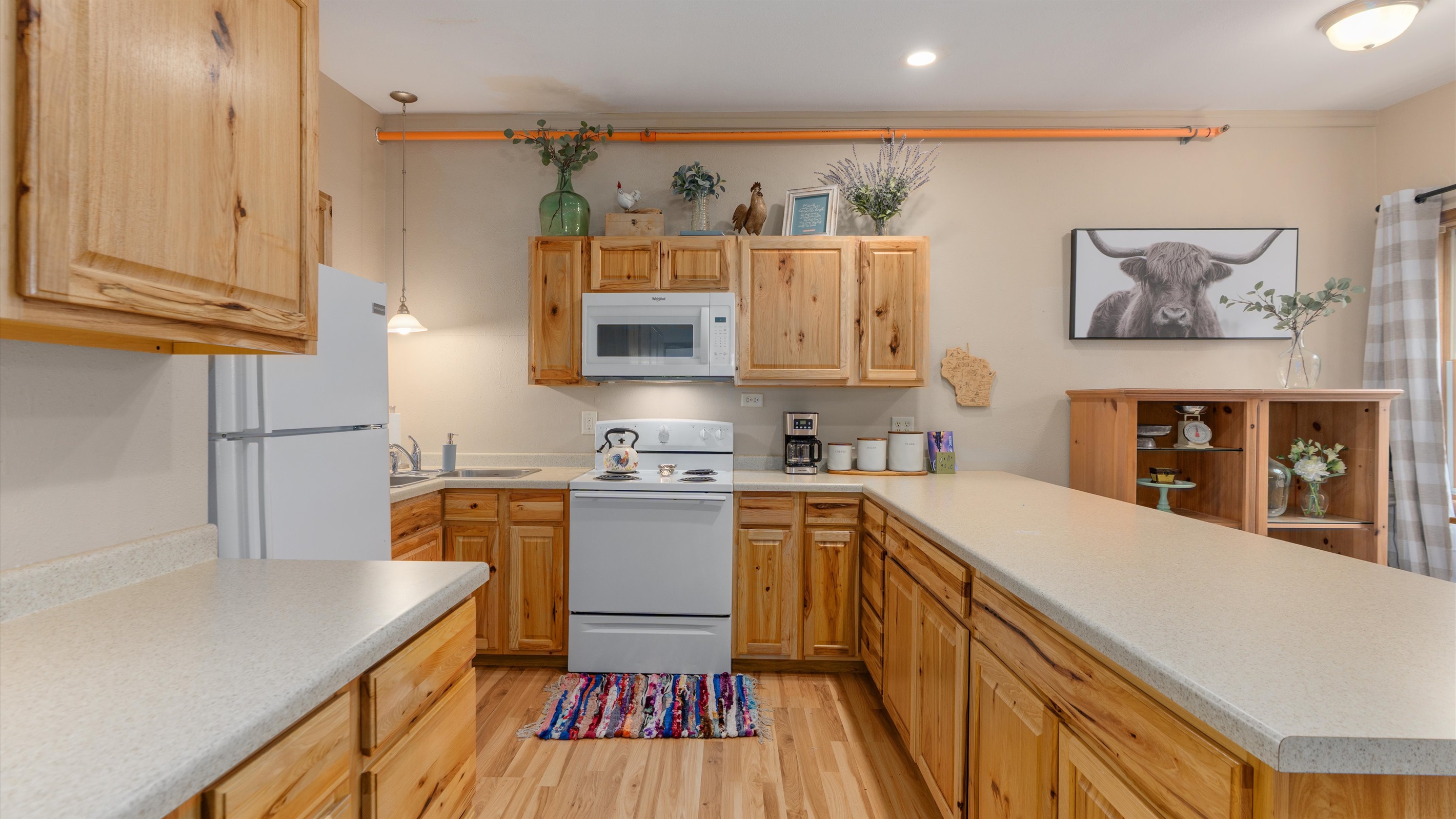 Raindrop has a fridge, stove and microwave for your use. 
