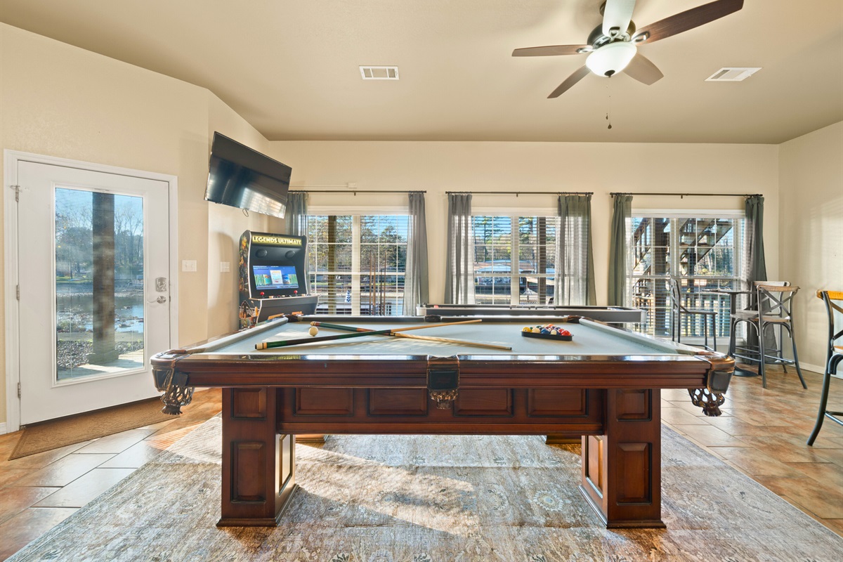 With its open feel and bright windows, the pool table area invites friendly competition in a relaxing environment.