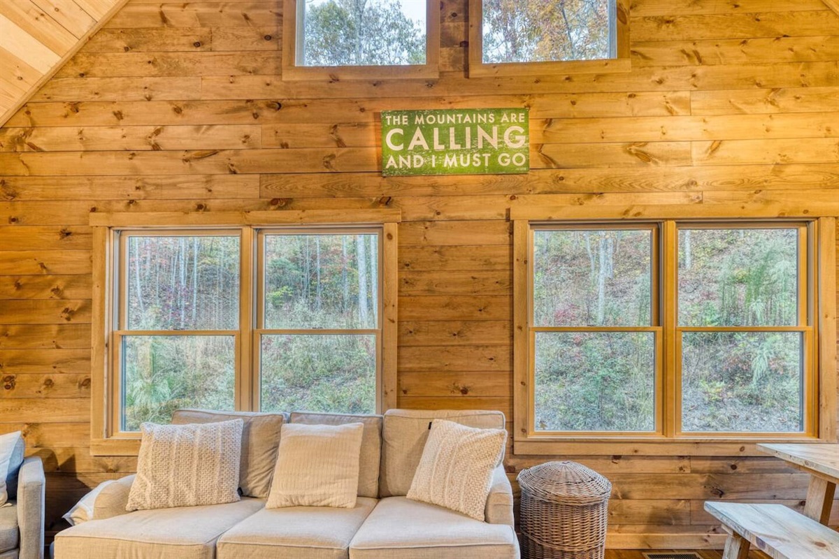 Our cabin's inviting sitting area offers a warm retreat, complete with plush furnishings and rustic charm.