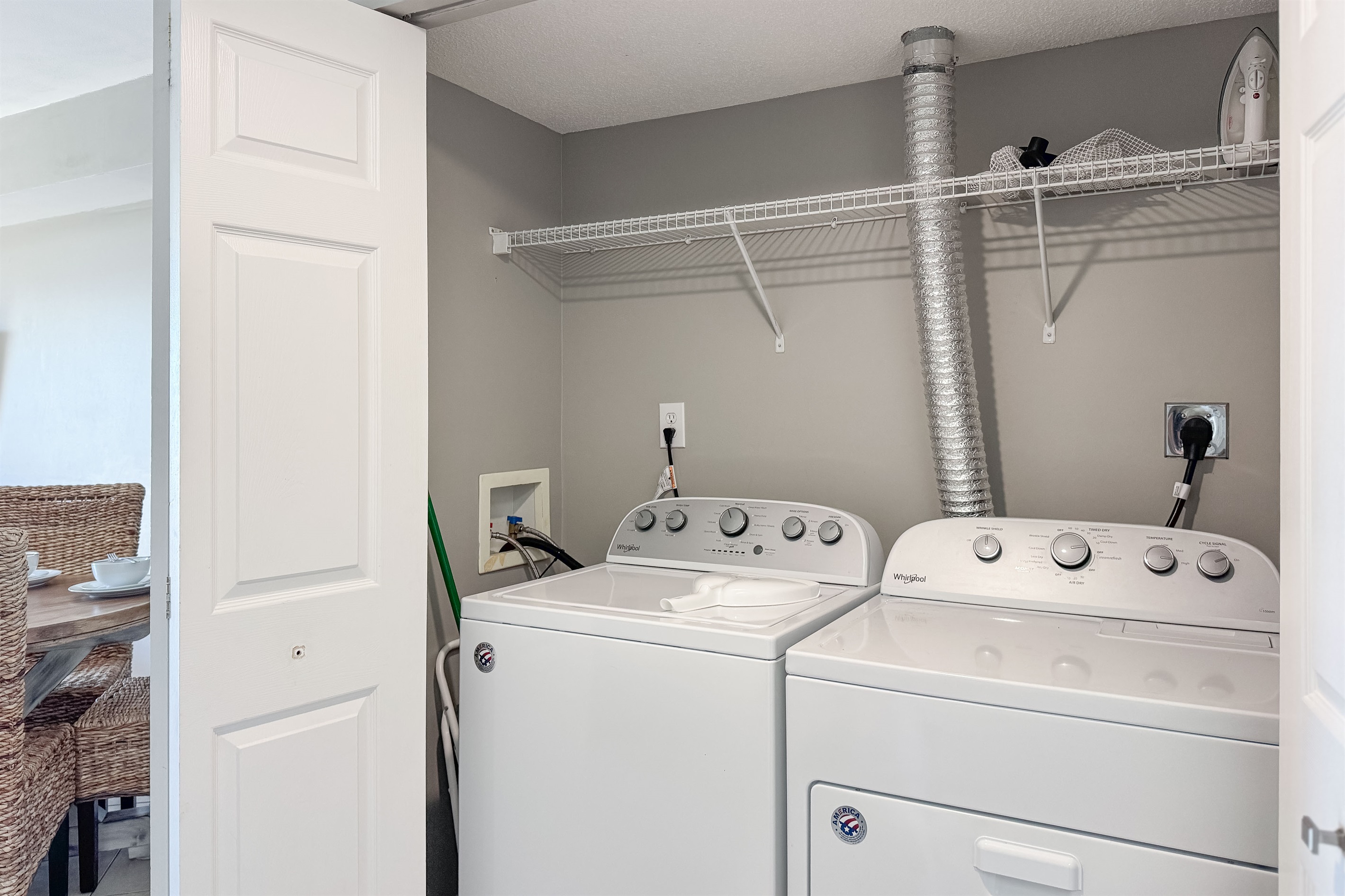 This well-equipped utility closet offers ample storage and a in-unit washer/dryer for your everyday needs.