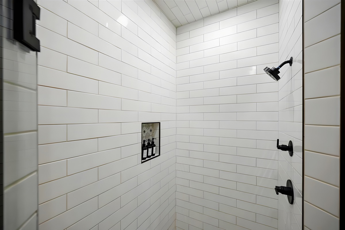 Clean lines and modern tile work make this shower space feel simple, bright, and refreshing.