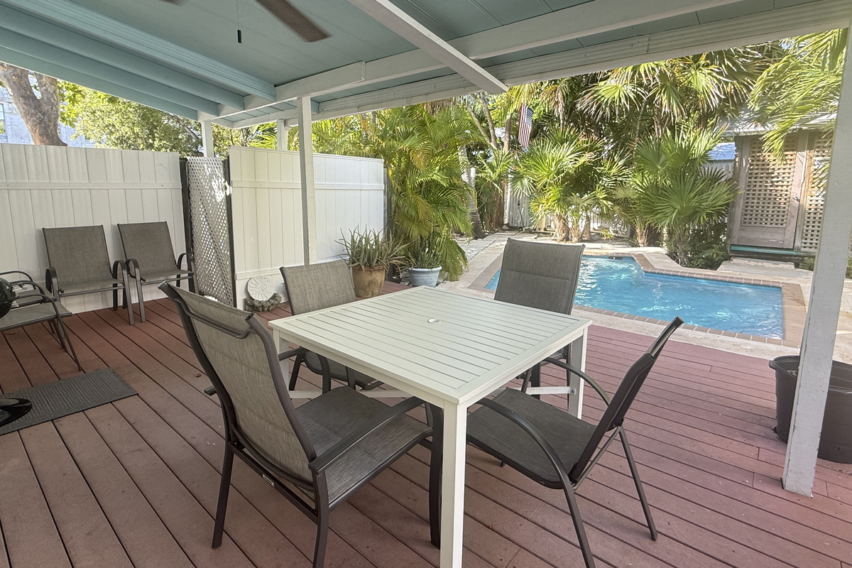 Unwind in your private tropical oasis, where lush greenery surrounds a serene pool. Sip your morning coffee or enjoy an al fresco meal on the spacious deck.