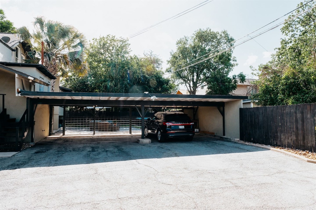 Three covered spaces but room for five more cars.