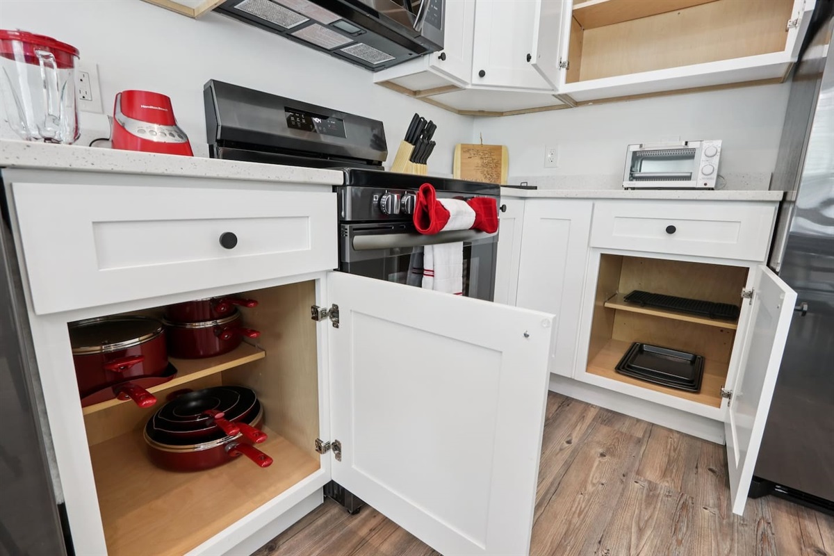 Coffee mugs with Keurig coffee maker (pods included), hot water heater, mini waffle maker, blender, stove, oven, dishwasher, fridge, filtered water, knives, cutting board, pots/pans, baking sheets, utensils.  