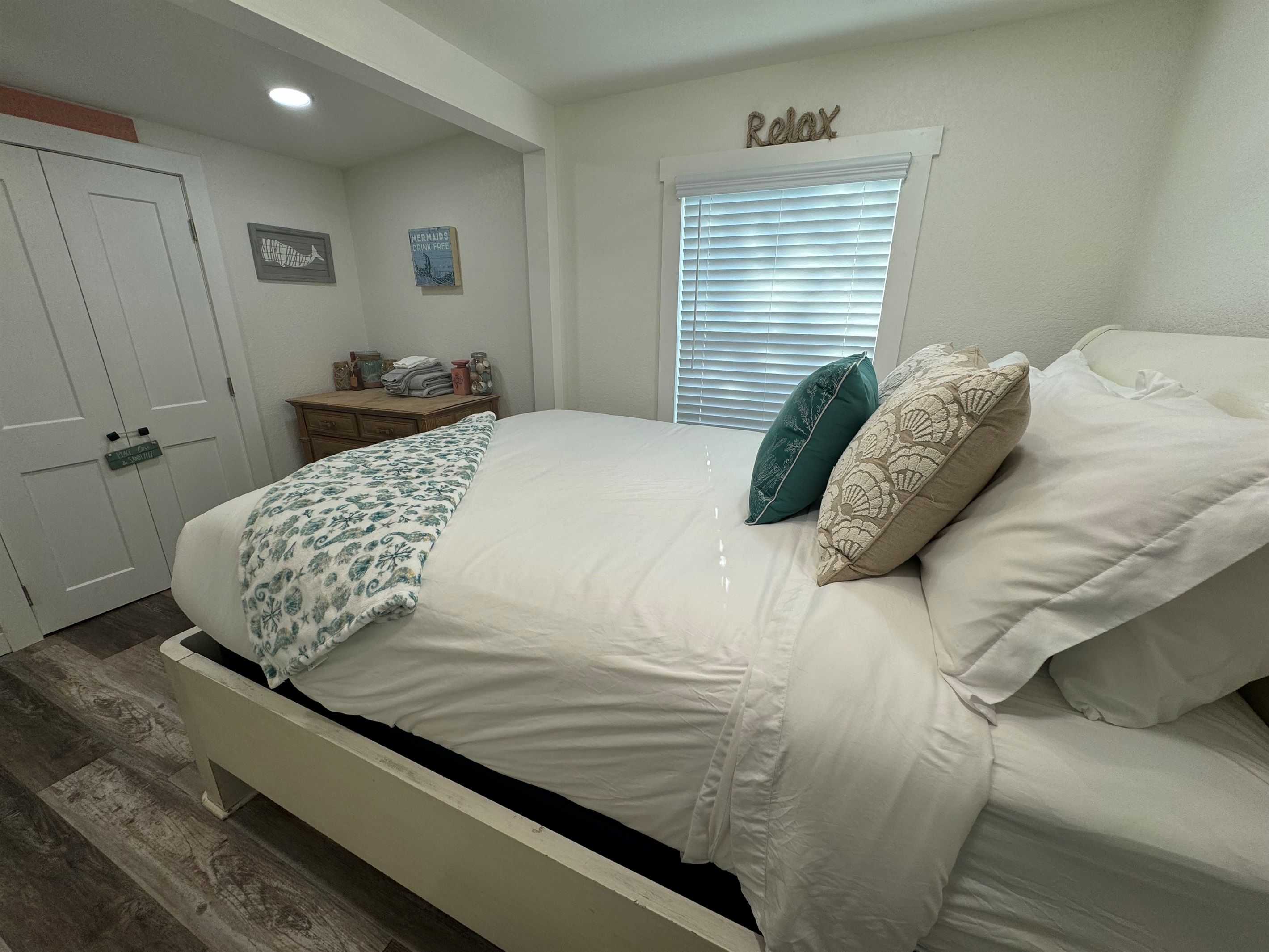 Bedroom with queen bed and smart tv
