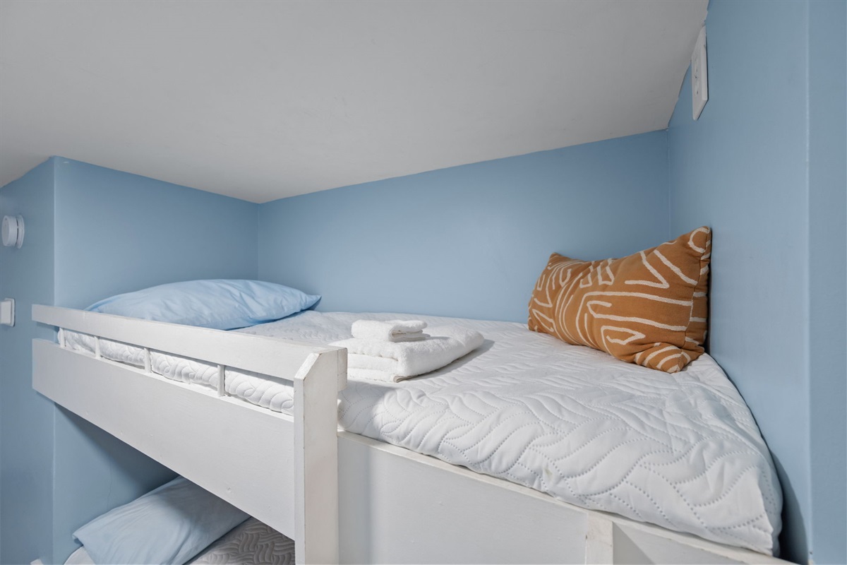 Tucked-away sleeping nook that keeps the living area open and uncluttered