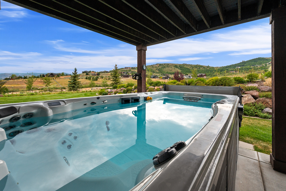 Large Swim Spa with views of the mountains and landscape. 