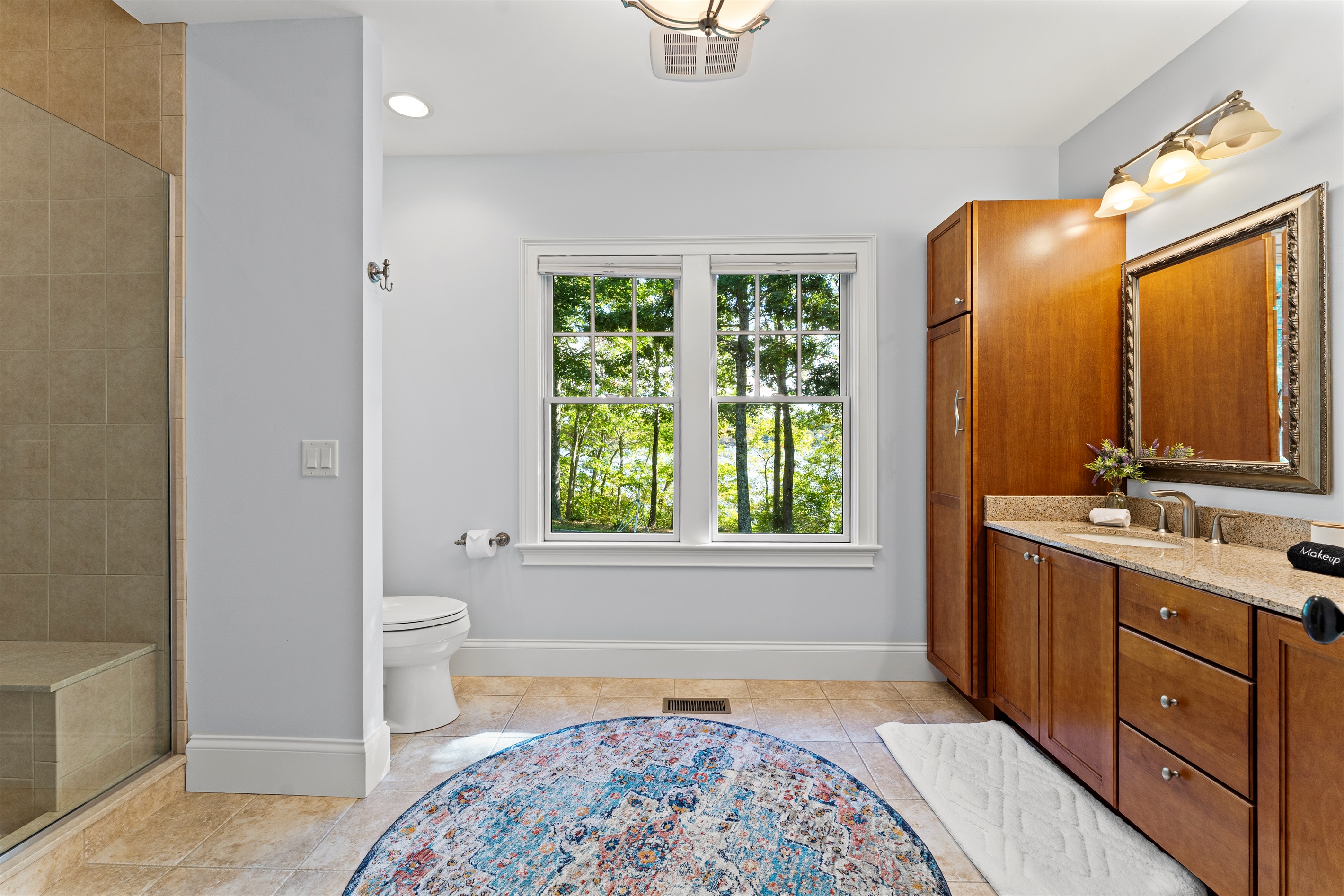 A roomy layout with double vanities, perfect for couples or friends sharing the space.