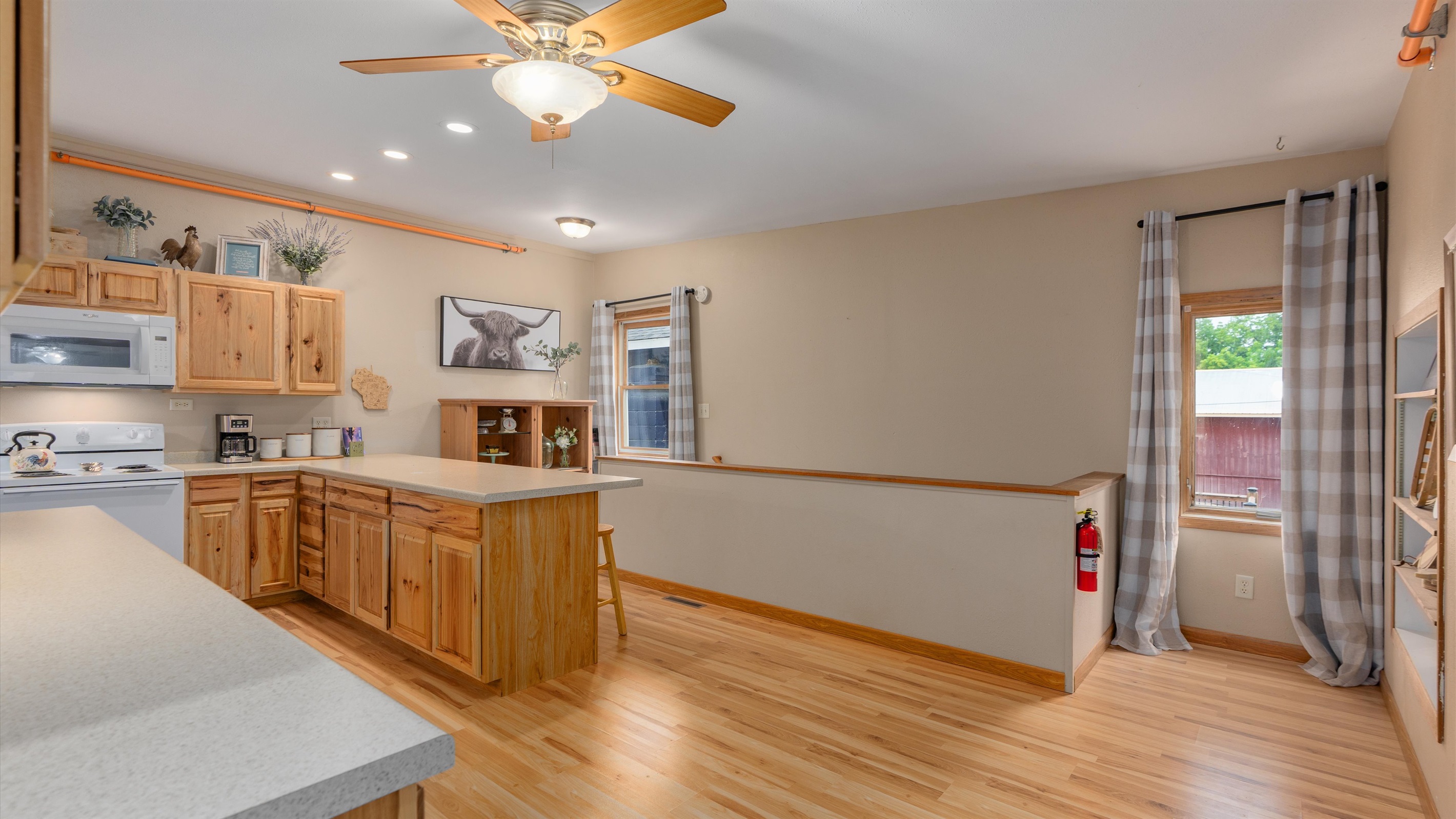 Raindrop's large kitchen flows into the living room, then down a small hallway to the rest room.