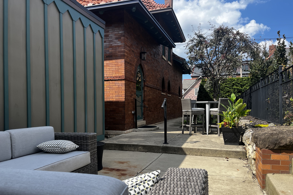 The private patio: lounge seating and a bar-height table