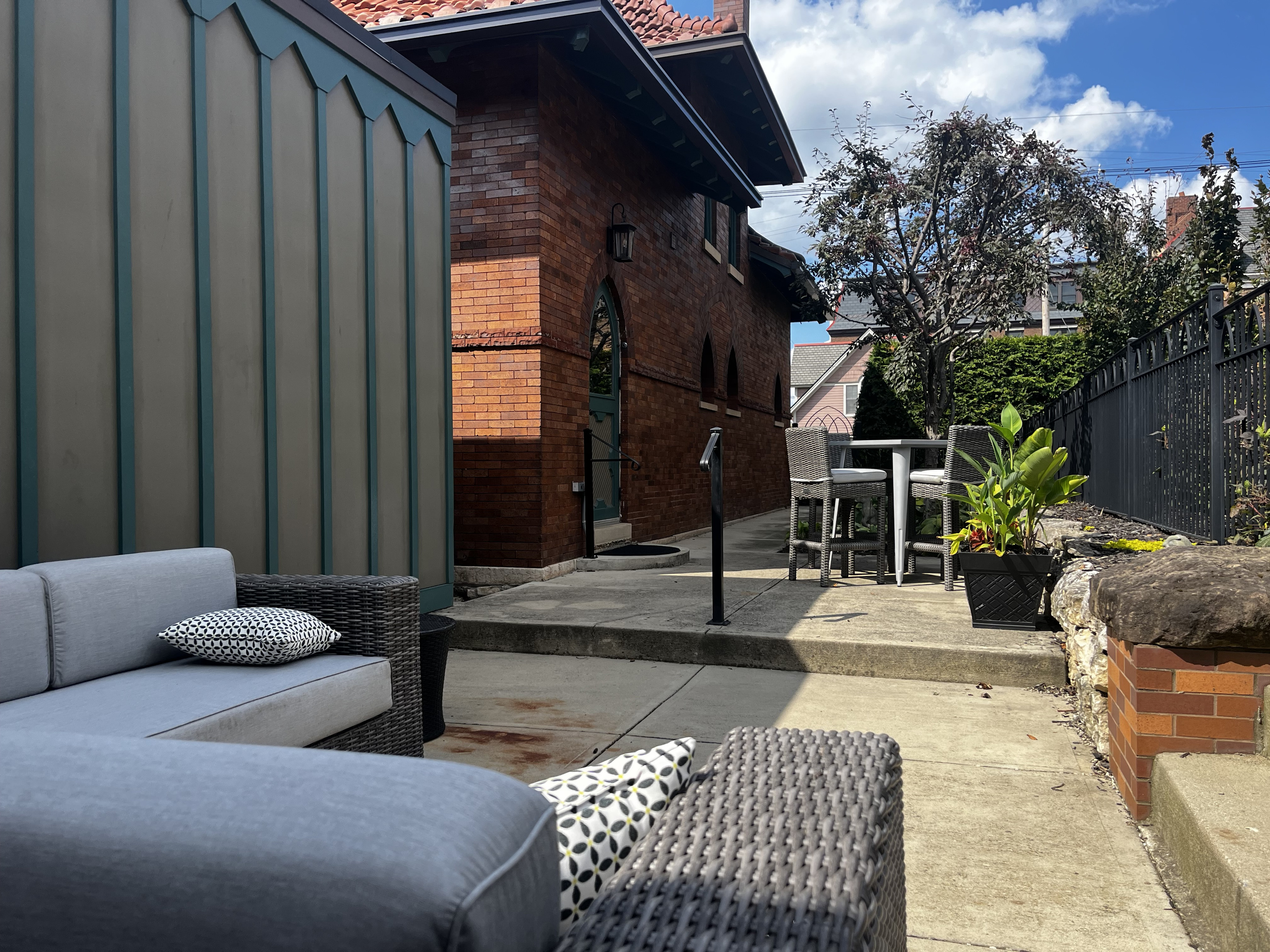 The private patio: lounge seating and a bar-height table