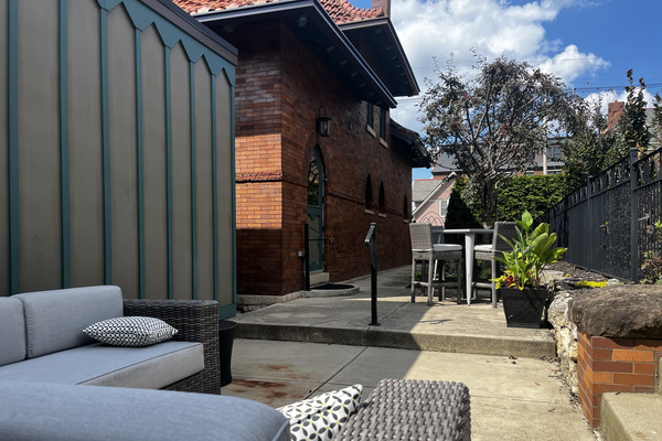 The private patio: lounge seating and a bar-height table
