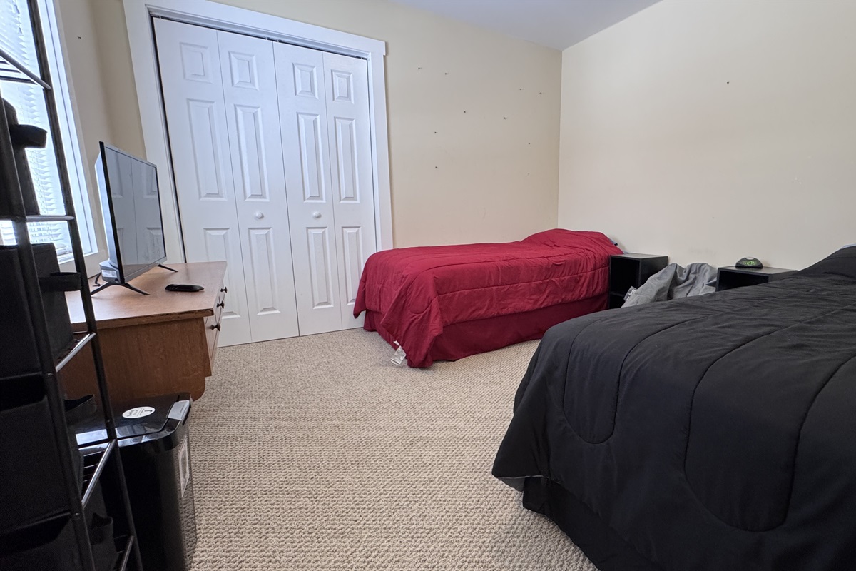 3rd bedroom with 2 twin beds and a desk