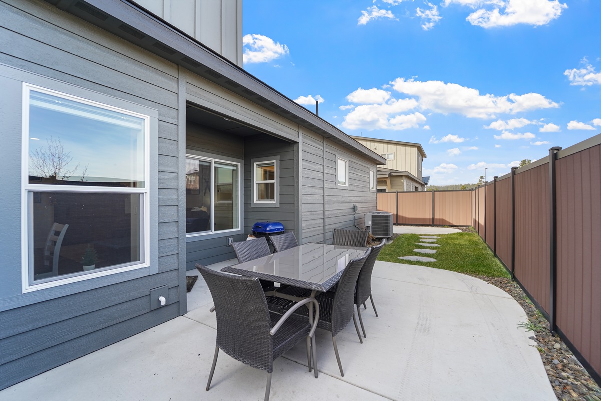 Enjoy outdoor dining on the patio with seating.