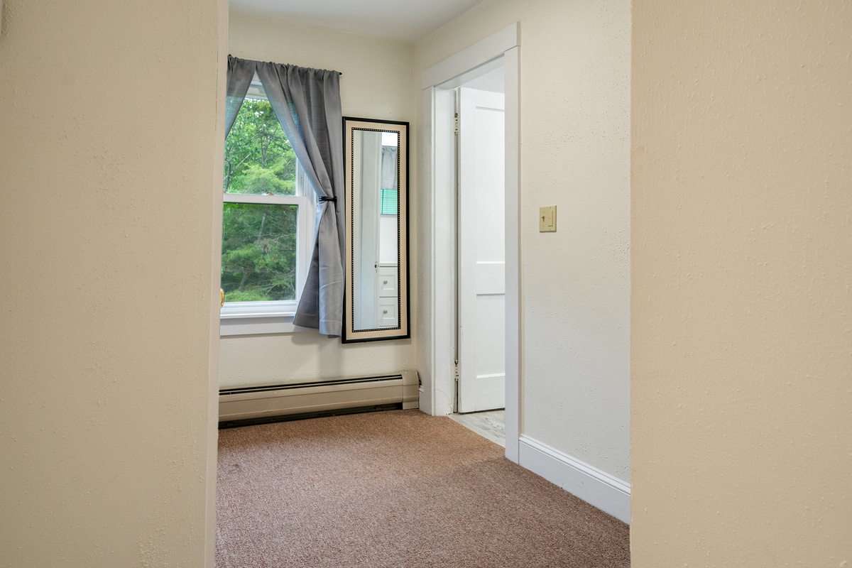 Streamline your morning routine with another convenient dressing station. Located in the upstairs landing right outside the full bathroom door, this extra full-length mirror lets you double-check your outfit and keeps the group moving on schedule.