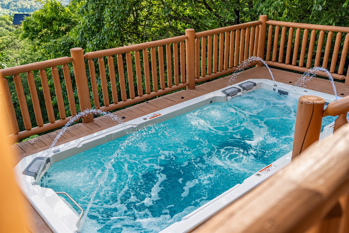Soak among the trees in the private swim spa, where serenity meets the sounds of the Smokies.