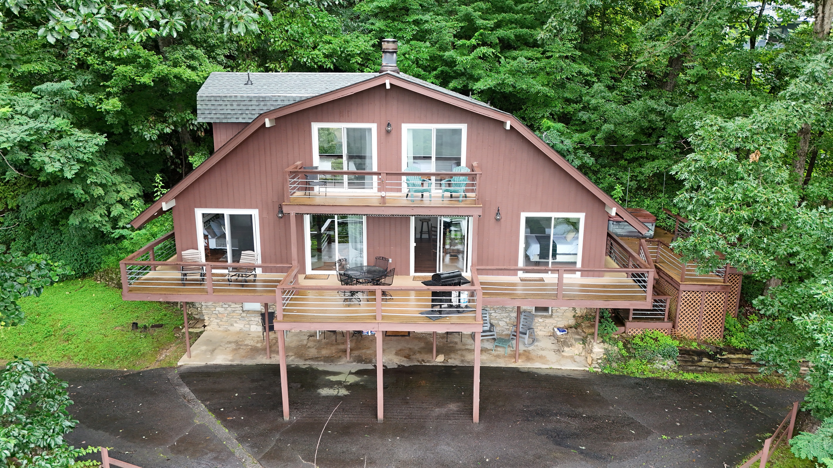 Exterior Retreat: Relax on expansive decks surrounded by lush greenery and fresh mountain air!