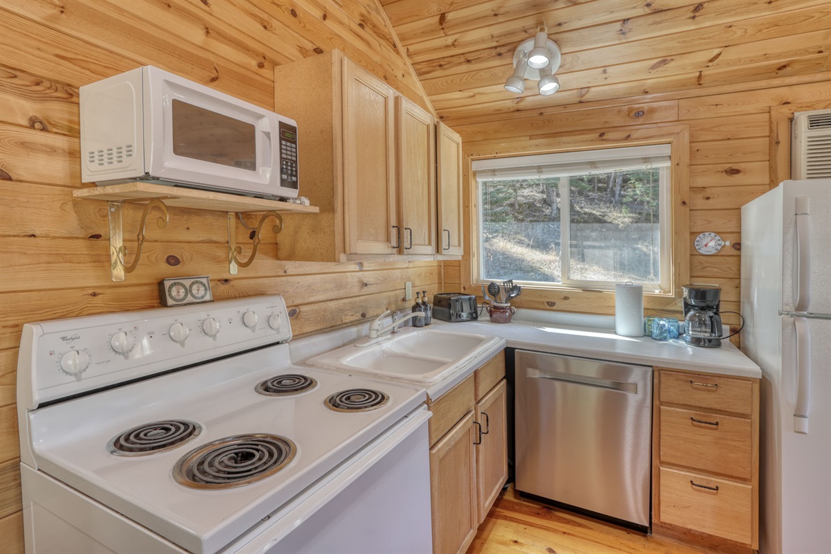 Kitchen with oven, stove, microwave