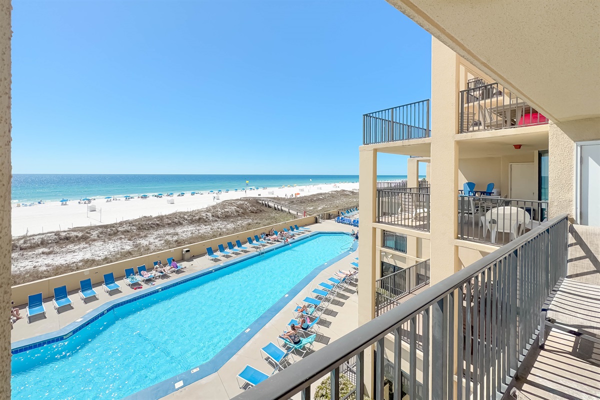Wake up to this! Start your day with coffee on your private balcony, overlooking the beach and pool. The perfect escape.