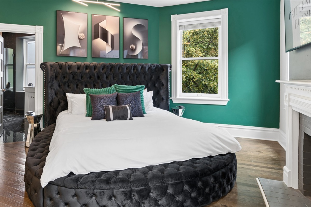 Retreat to the spacious primary suite featuring a king bed, fireplace, and private sunroom.