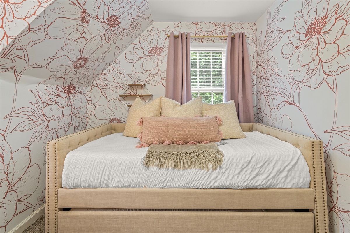 Twin bed with trundle, don't forget to look for the hidden closet.