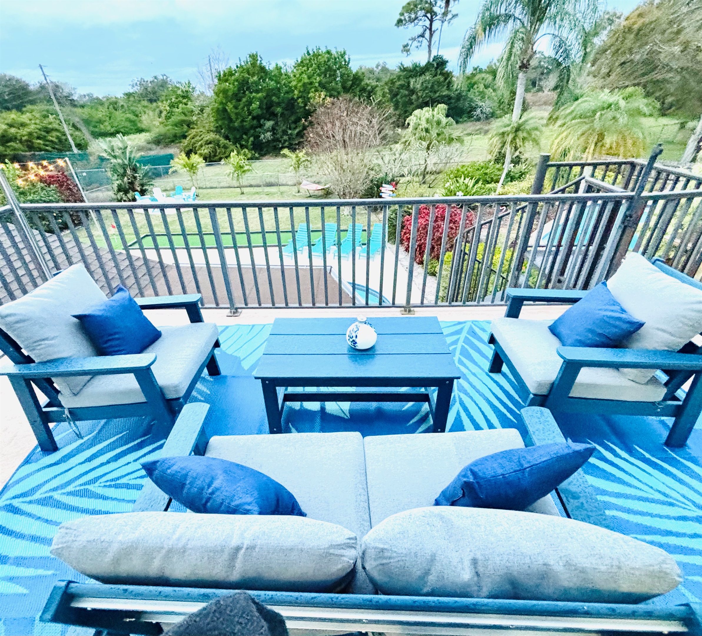 Balcony seating upstairs overlooking the backyard pool/spa.