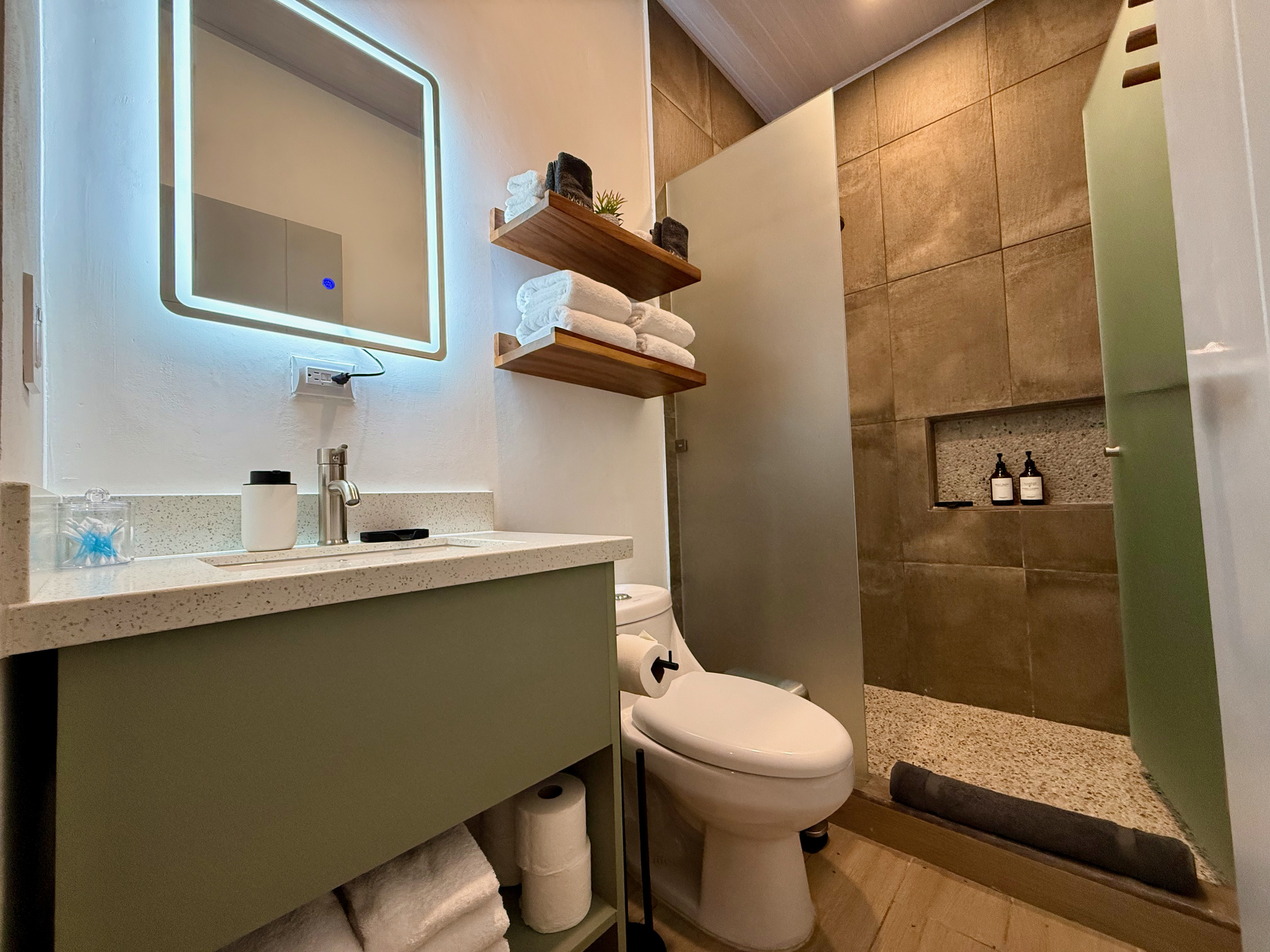 Second full bathroom — same rain shower, ceramic tile, LED vanity.