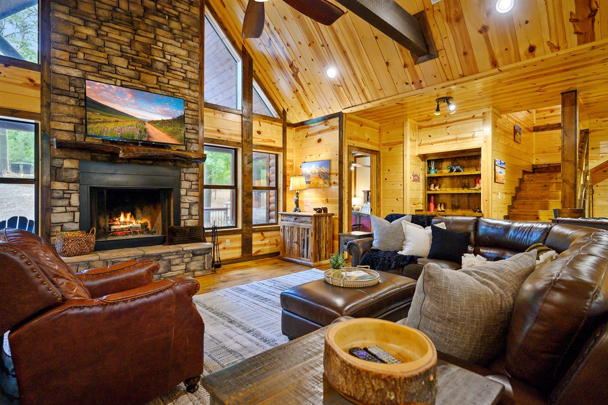 Living room: sectional couch and recliner.  Wood burning fireplace seasonal.