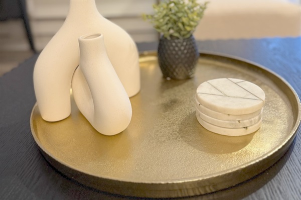 The condo is tastefully designed using a variety of decorative items  and materials