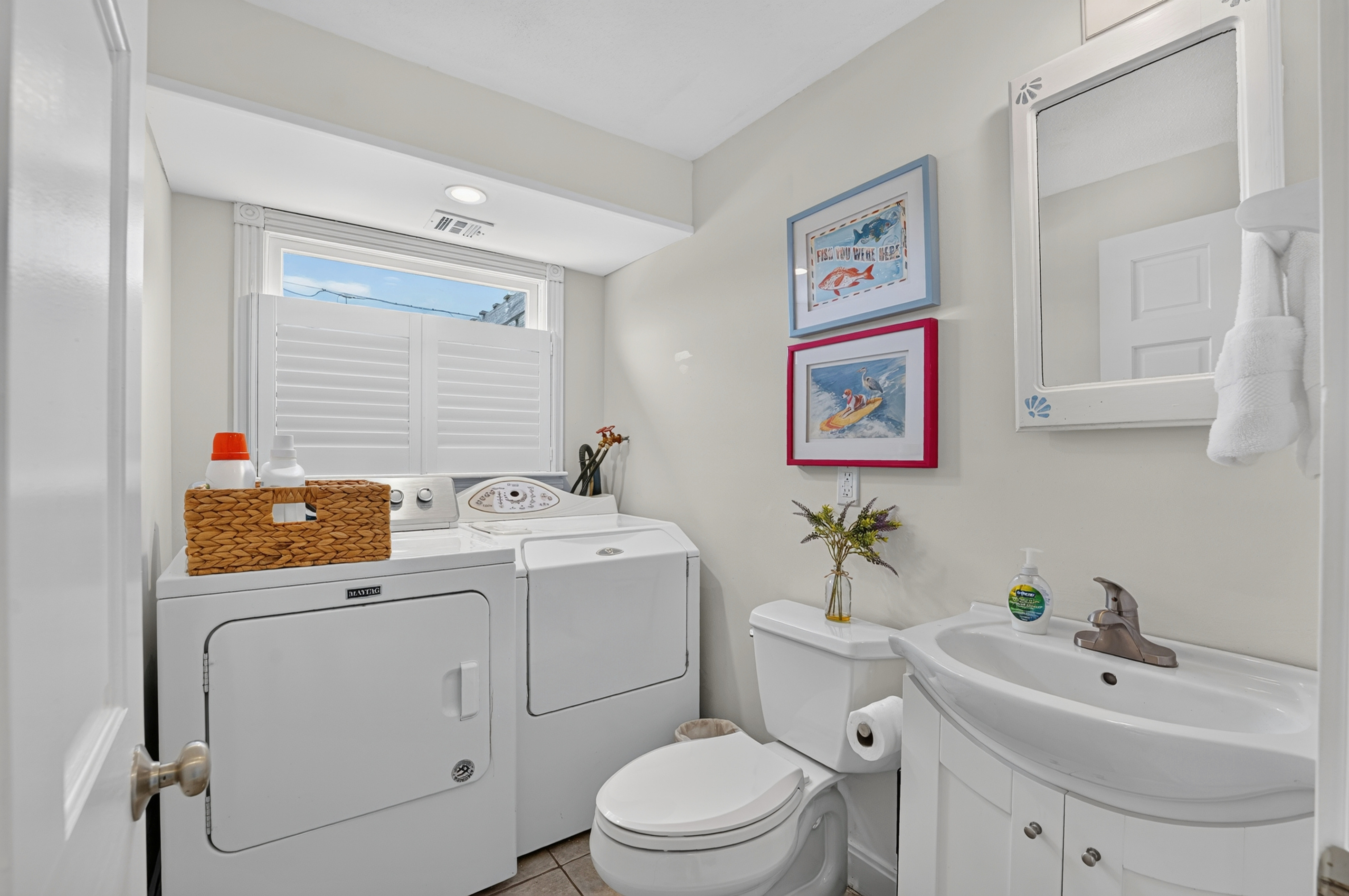 Convenient laundry area with a washer and dryer, making longer stays and beach days easier.