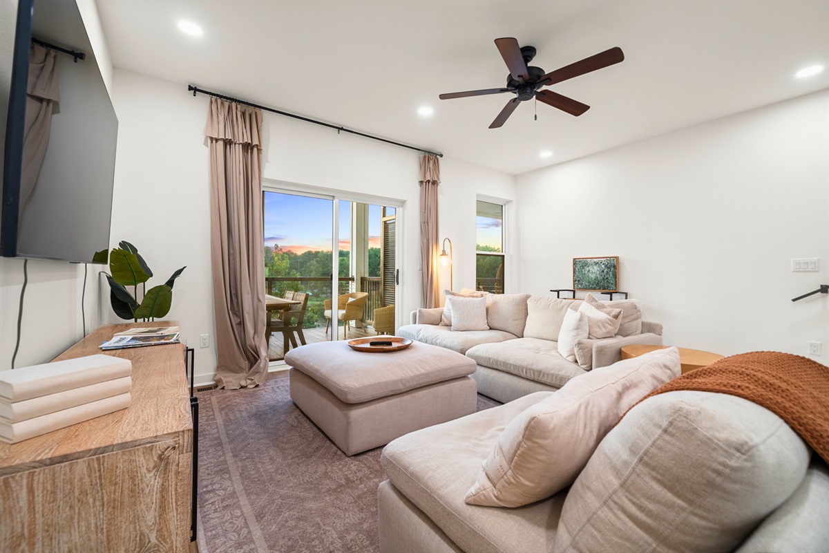Cozy living area with plenty of seating and natural light.