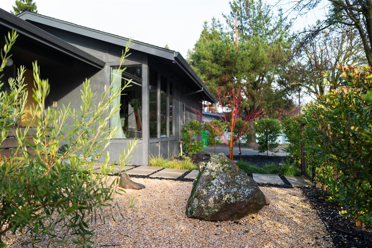 Surrounded by beautiful Napa Valley scenery, the home's exterior showcases inviting outdoor spaces, manicured grounds, and plenty of areas to relax and enjoy the California sunshine.