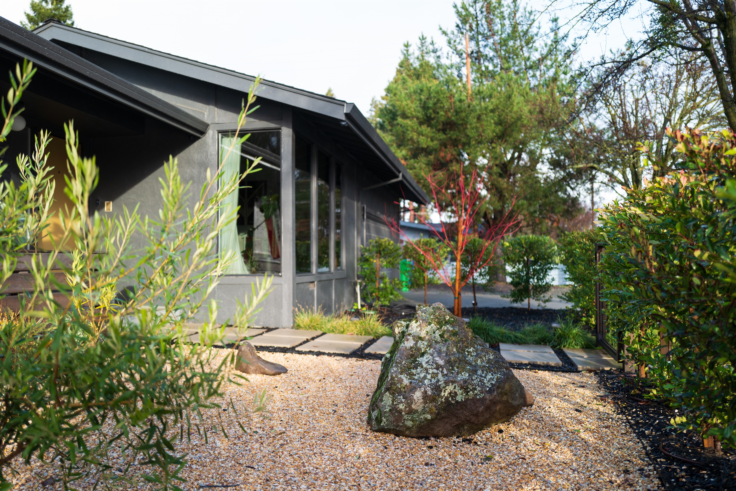 Surrounded by beautiful Napa Valley scenery, the home's exterior showcases inviting outdoor spaces, manicured grounds, and plenty of areas to relax and enjoy the California sunshine.