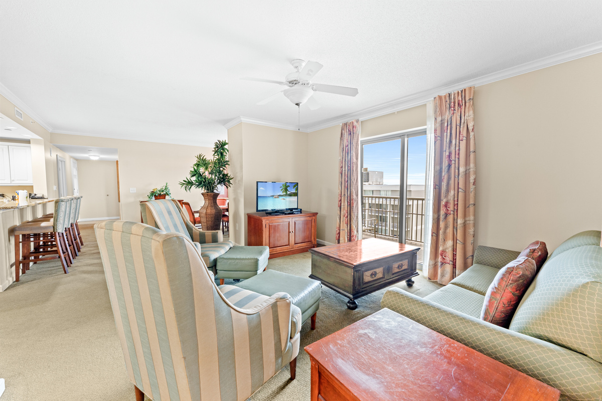 Open Livingroom with sleeper sofa and balcony access