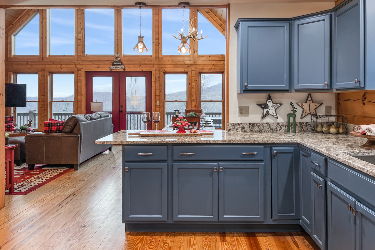 Fully equipped kitchen with beautiful mountain views and everything needed for preparing meals during your stay.