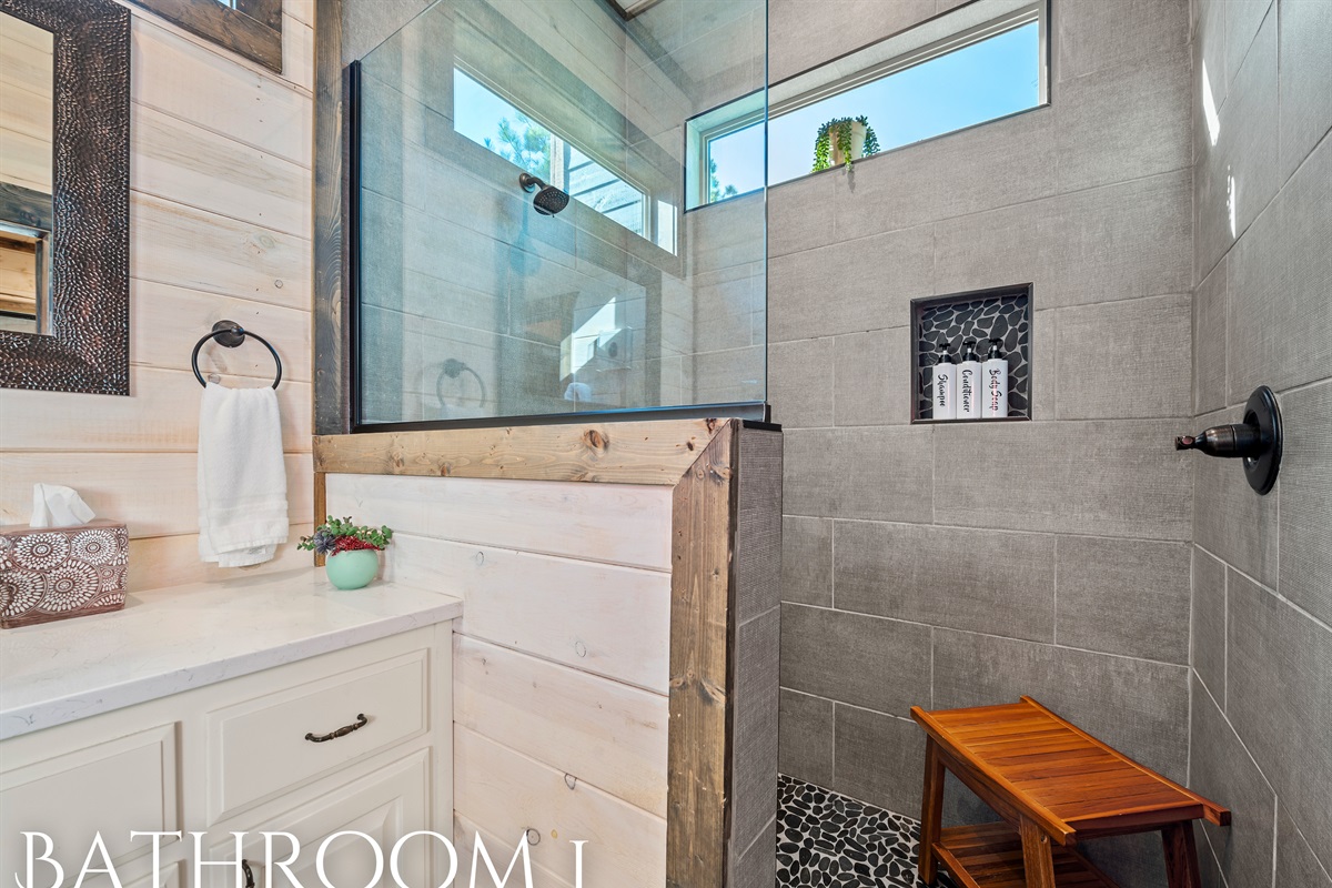 The luxurious en-suite bathroom offers a spa-like feel with a large soaking tub and plenty of natural light.