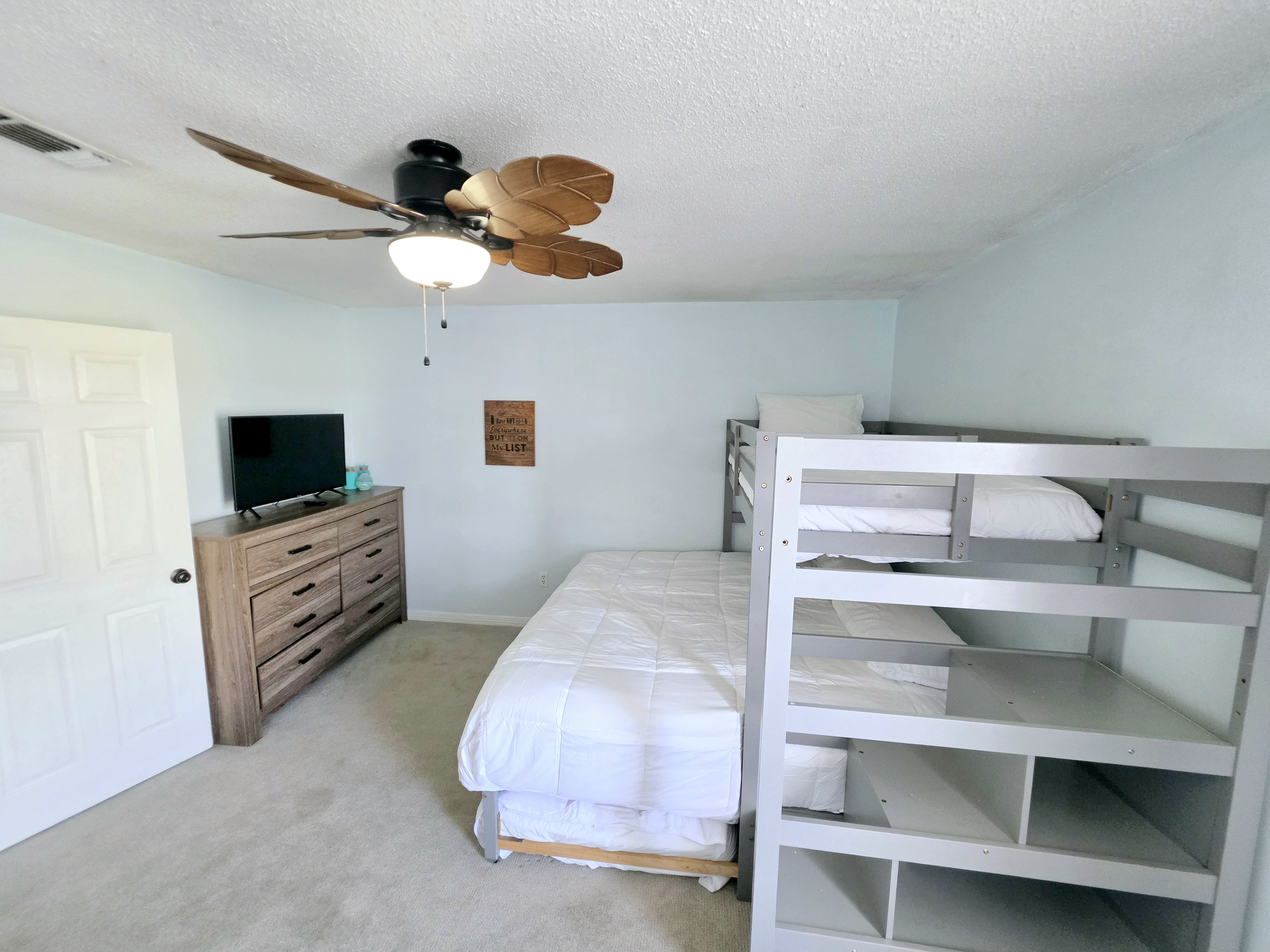 Nest side – Bunk room with TV and dresser