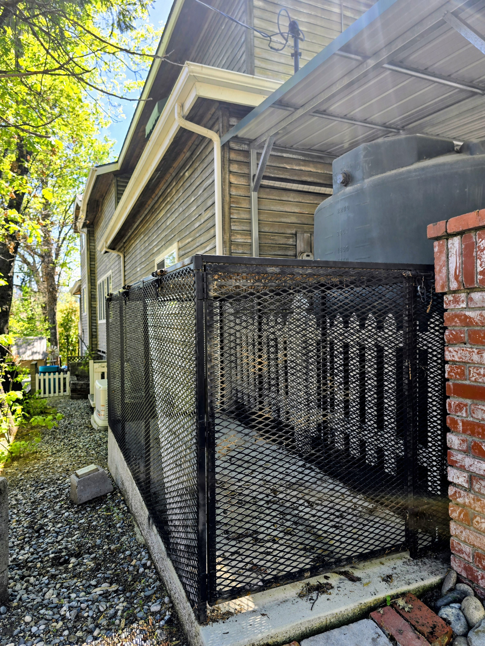 Side yard to the bear trash bins