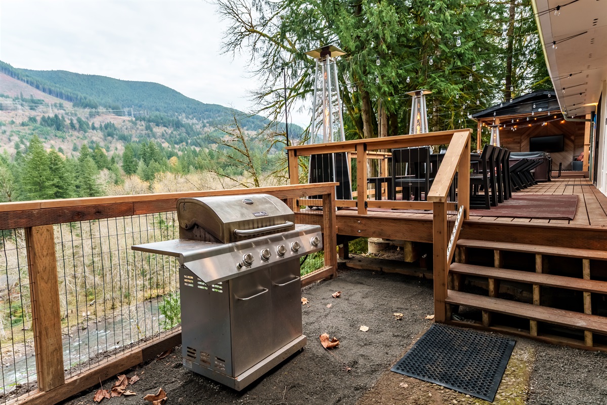 Fire up the grill with sweeping mountain and river views—an unforgettable spot to cook, relax, and enjoy the fresh forest air just steps from the deck.