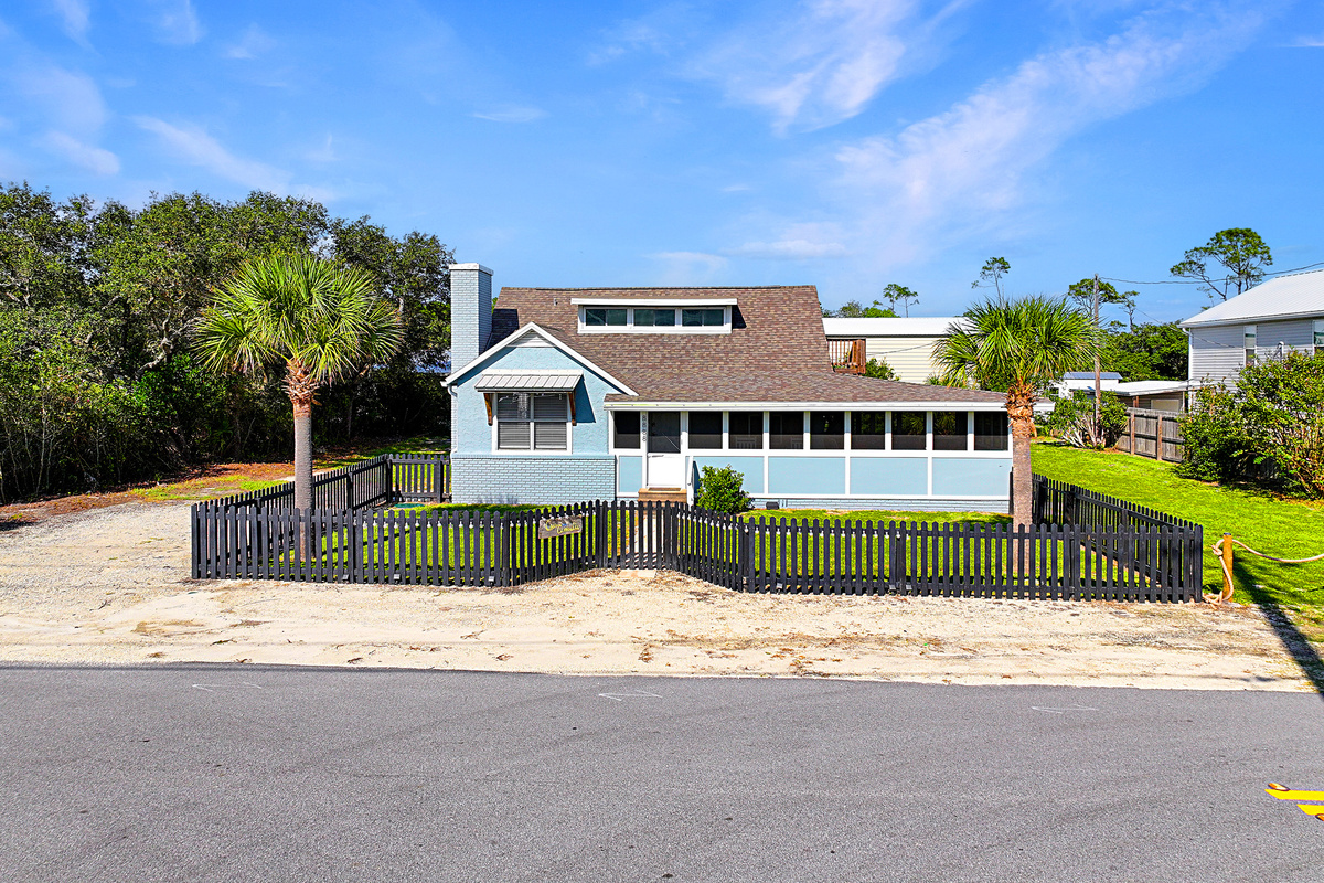 Fenced yard, plenty of parking, long screened in porch