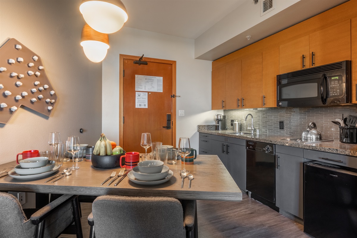 The kitchen is designed for ease, with everything you need close at hand and an open layout that keeps you part of the conversation while cooking.