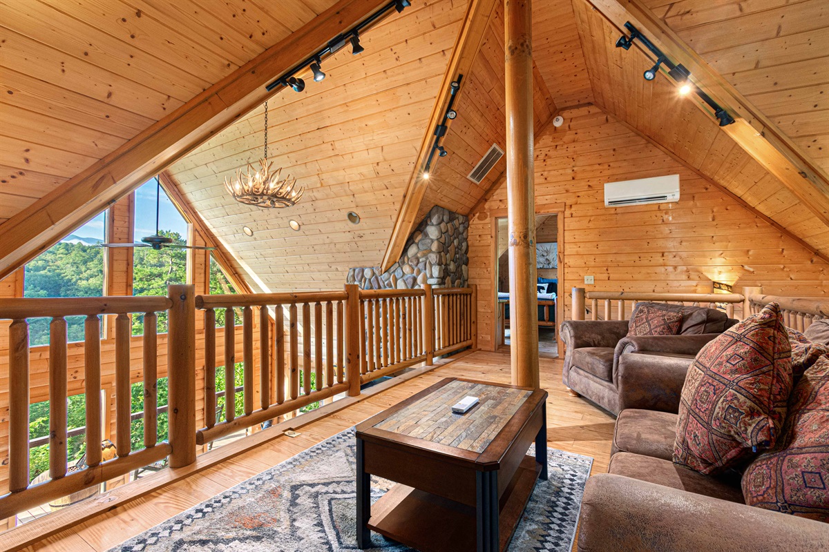 Upstairs Family Room: Enjoy breathtaking views from this bright, spacious retreat! Perfect for gathering.