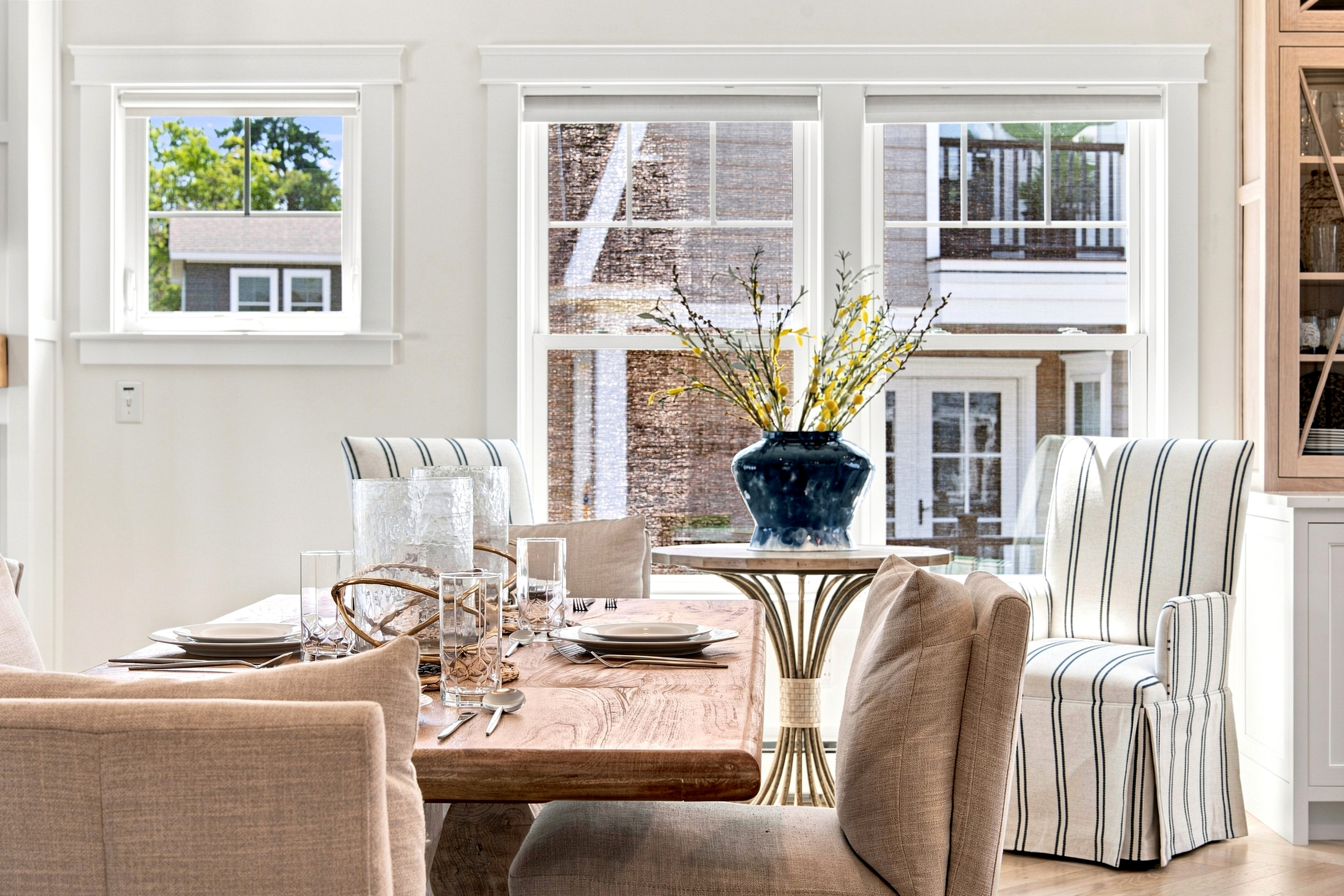 Gather around the dining table for relaxed meals in a bright, welcoming space filled with natural light.